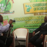 CWA ini Suriname - interview against backdrop
